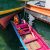 Local Sea Nomad boat captain navigating waters near Semporna, Malaysia