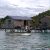 Two Bajau Laut boys rowing a small handmade boat off the Malaysian coast
