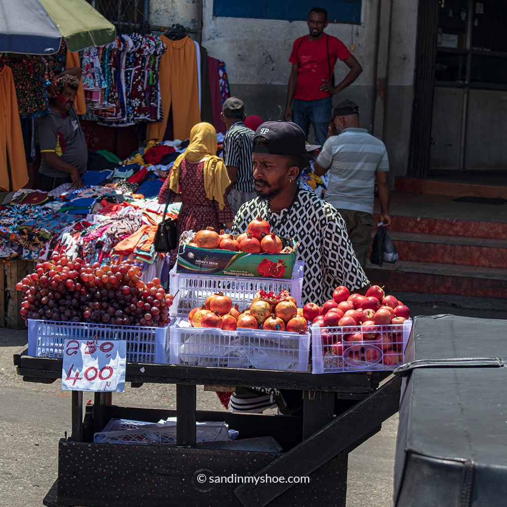 Man selling fruit and vegetables in Pettah market.